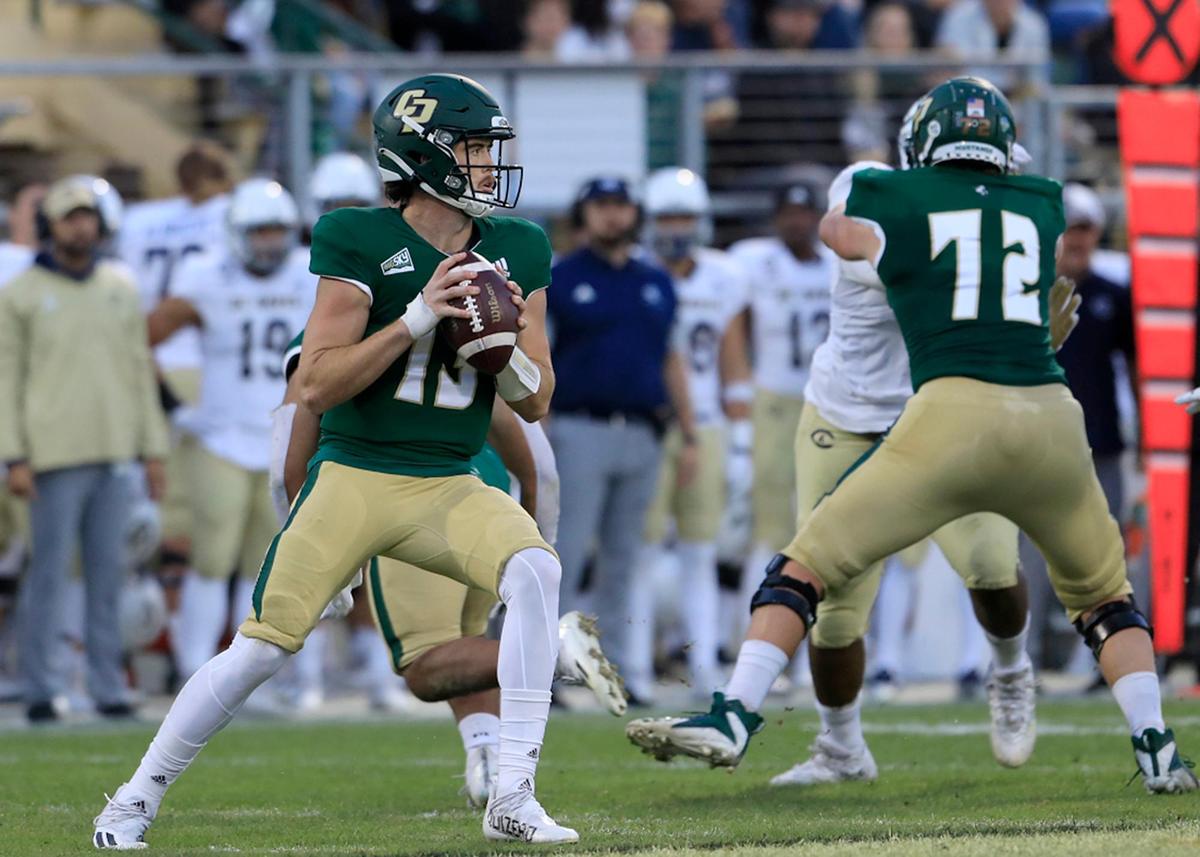 Cal Poly quarterback (13) Spencer Brasch looks for a receiver in the Mustangs’ 24-13 loss to UC Davis at Alex G. Spanos Stadium on Saturday, Oct. 23, 2021.