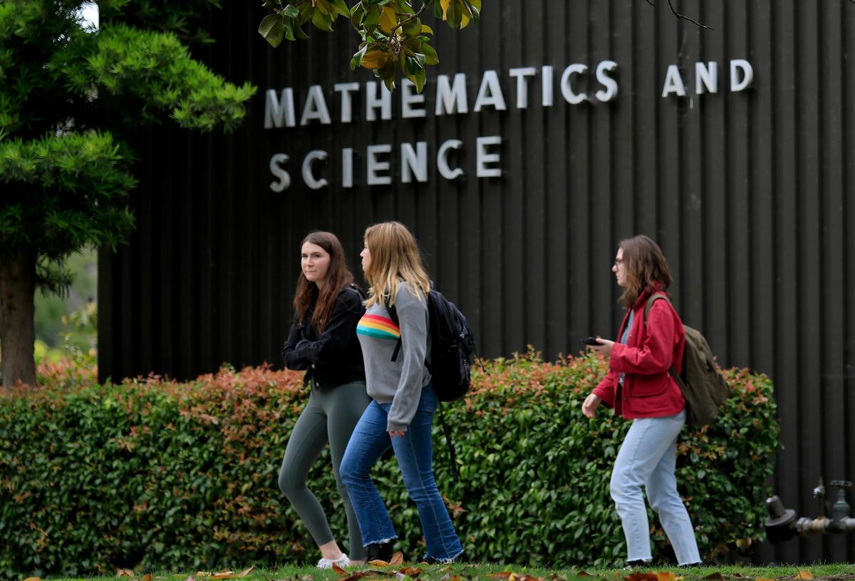 Cal Poly students walk past the mathematics building on campus. The university accepted only 28% of freshman applicants for fall 2019.