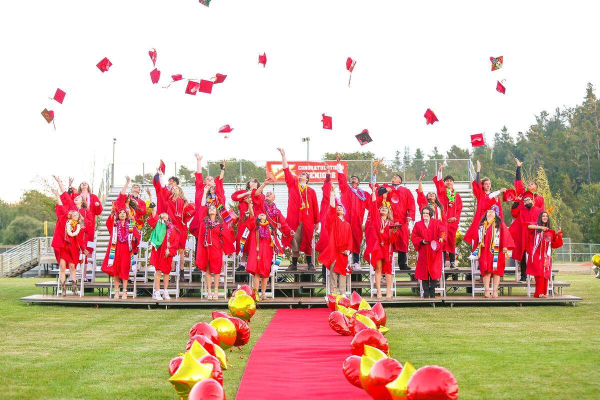 Coast Union High School grads toss their mortarboards into the future on June 3. 