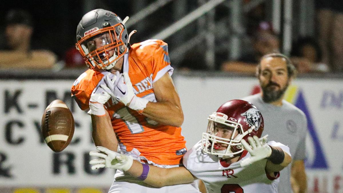 A pass falls incomplete as C.J. Bell and Shane Vaughn battle for the ball. In the annual rivalry game, Paso Robles beat Atascadero 35-21 on Sept. 2, 2022.