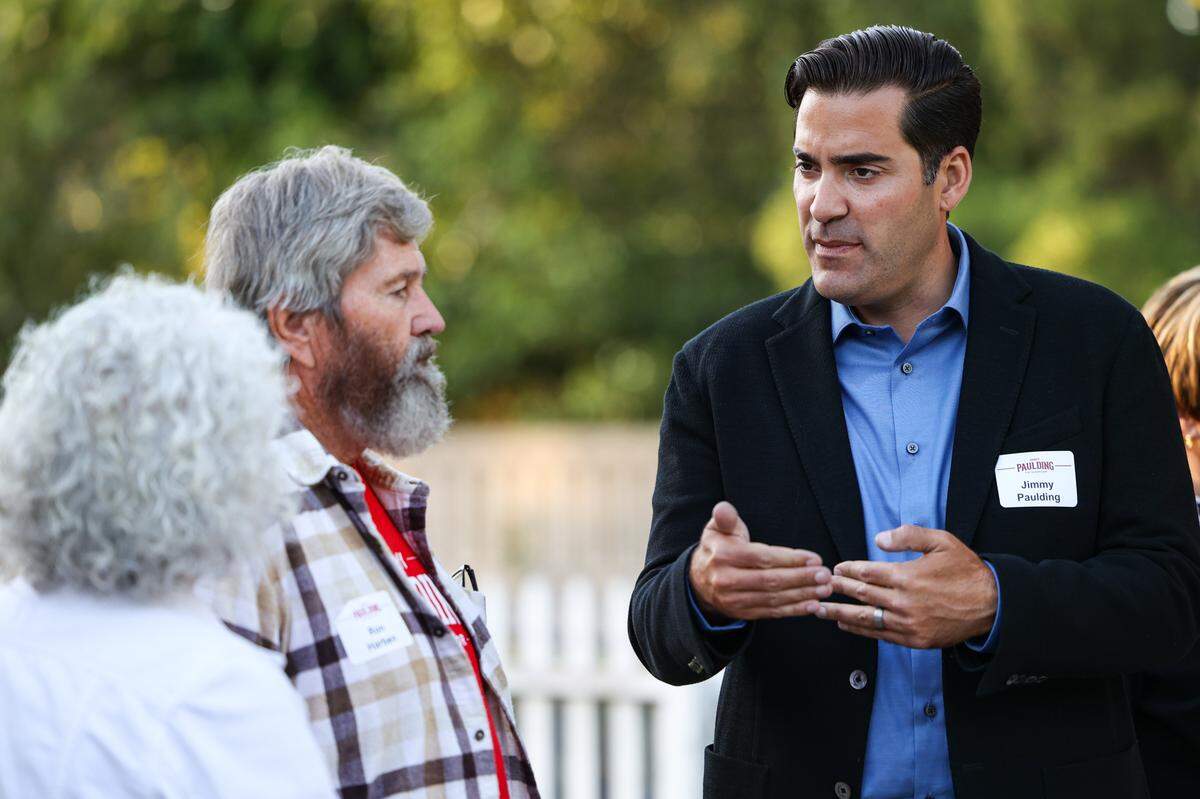Jimmy Paulding, right, talks to Bev and Ron Harben at Heritage House in Arroyo Grande on election night, Tuesday, June 7, 2022