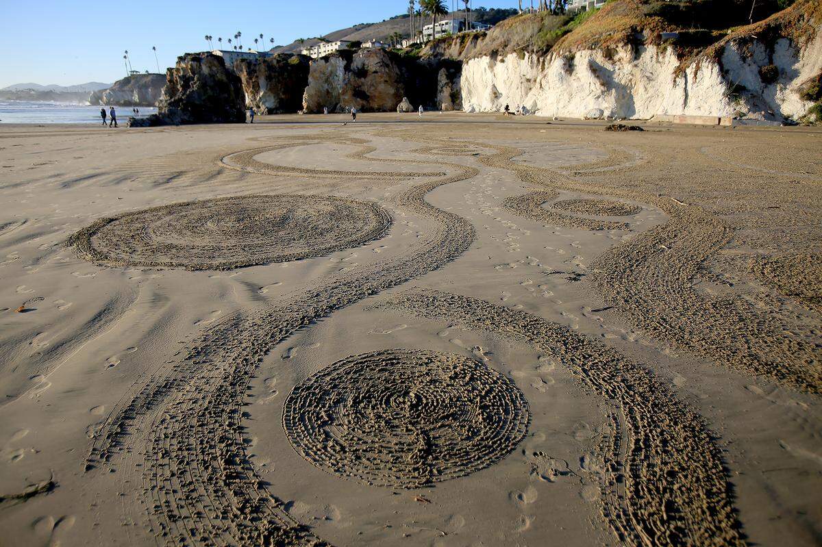The Pismo Beach Sand Art Festival runs Nov. 6 to Nov. 8 as artists carve sand murals at low tide; view zones from SeaCrest, Wilmar Avenue, the pier or hotel rooftops. Artist Avery Kintner from San Luis Obispo spent four hours on the beach below SeaCrest OceanFront Hotel 