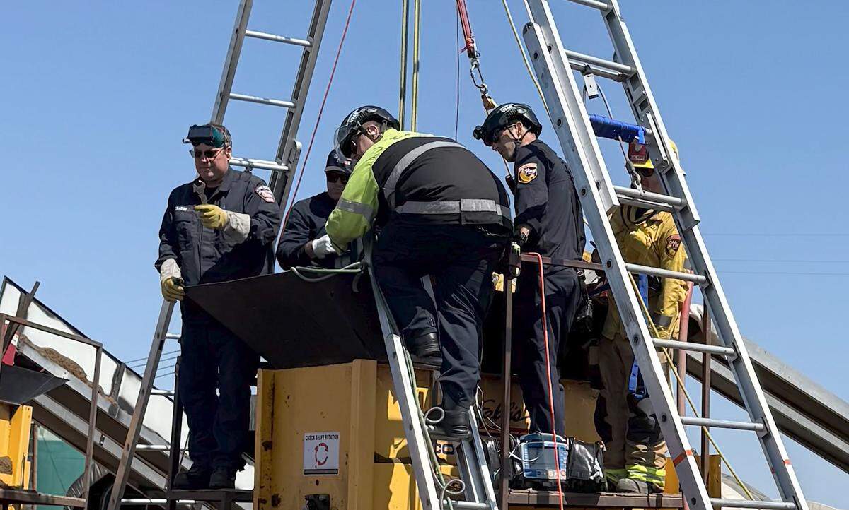 Cal Fire firefighters work to rescue a man caught in an industrial mulcher in Nipomo on Aug. 29, 2025.