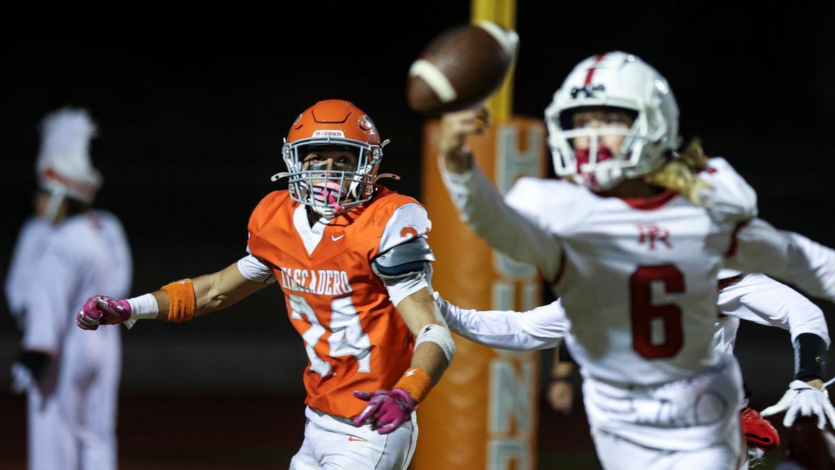 Parker Craig breaks up a pass intended for Damon Mitchell in Paso Robles’ 30-15 win over Atascadero in a high school football game on Sept. 20, 2024.