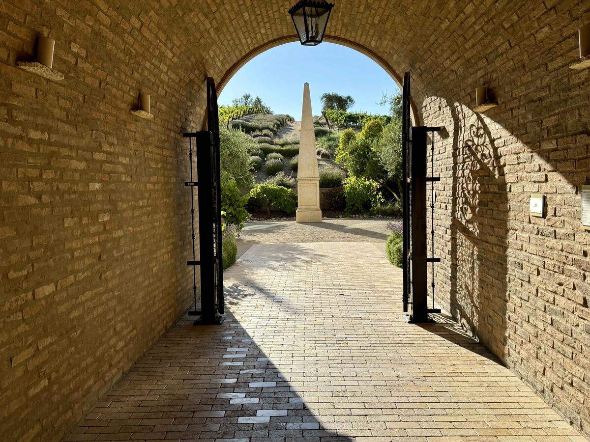 Allegretto’s Romeo and Juliet Hallway looks out on an obelisk and the gardens beyond.