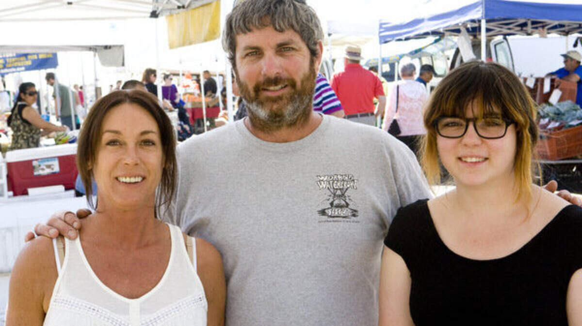 From left, Tiffani and Rob Seitz and daughter Isabelle Seitz run the South Bay Wild booth at the Morro Bay Farmers Market.