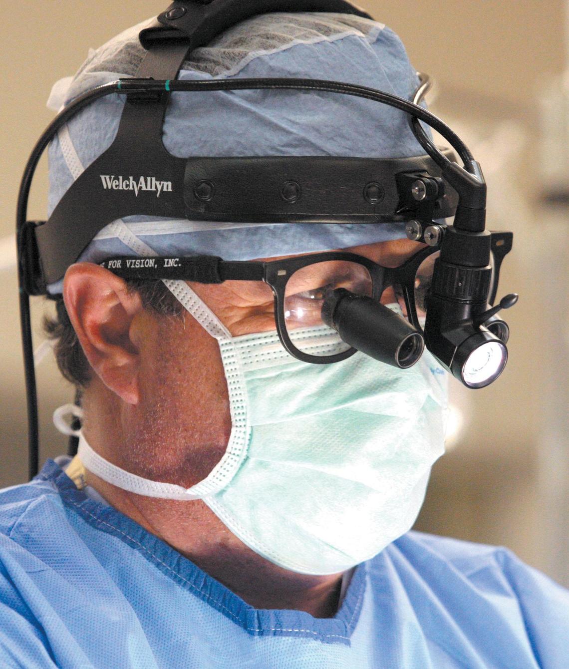 Dr. Luke Faber, cardiac surgeon at French Hospital Medical Center in San Luis Obispo, wears a light and magnifiers to help with a delicate heart bypass surgery on June 25, 2008.