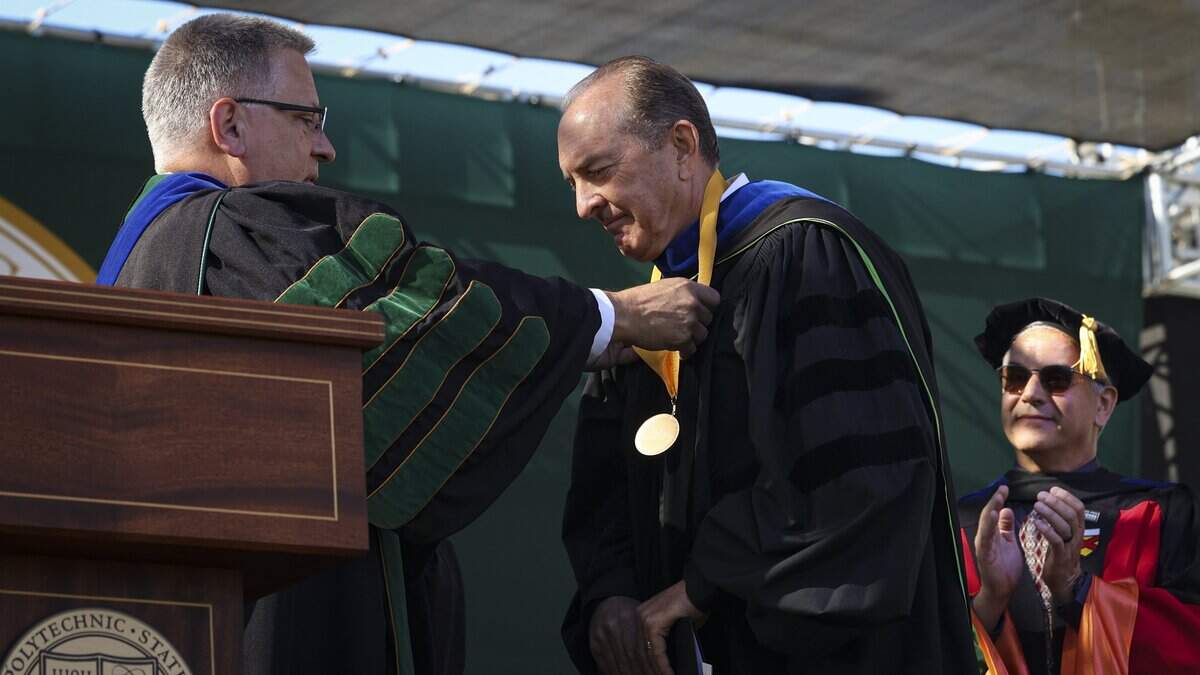 Charles (Chuck) L. Harrington is given the President's Medal of Excellence by President Jeffrey Armstrong. Cal Poly held the first of six graduation ceremonies at Spanos Stadium on June 13, 2026. The College of Agriculture, Food and Environmental Science held the first ceremony.