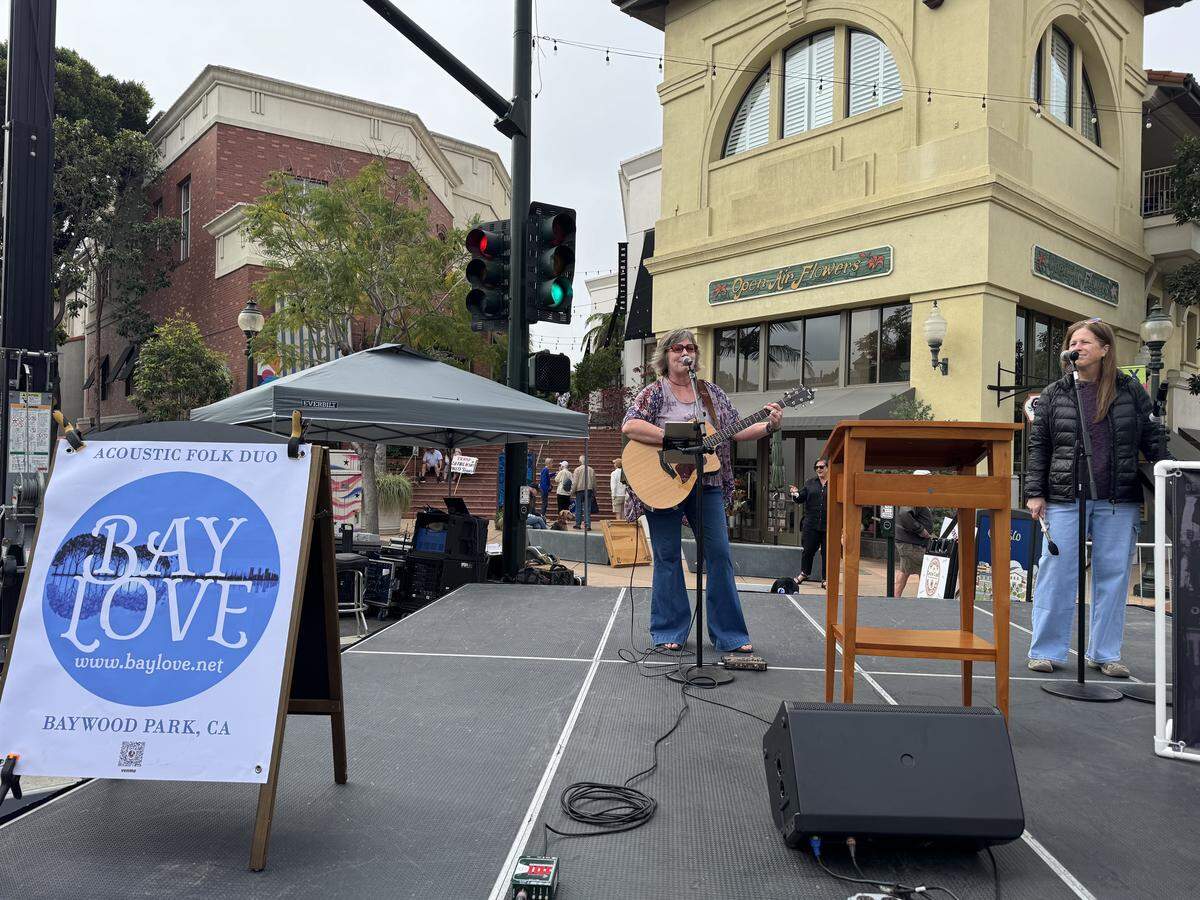 Residents across SLO County rallied downtown at the San Luis Obispo Superior Courthouse for a No Kings protest featuring speakers, music and community groups on March 28, 2026. Local acoustic folk duo Bay Love played protest songs for the growing crowd.