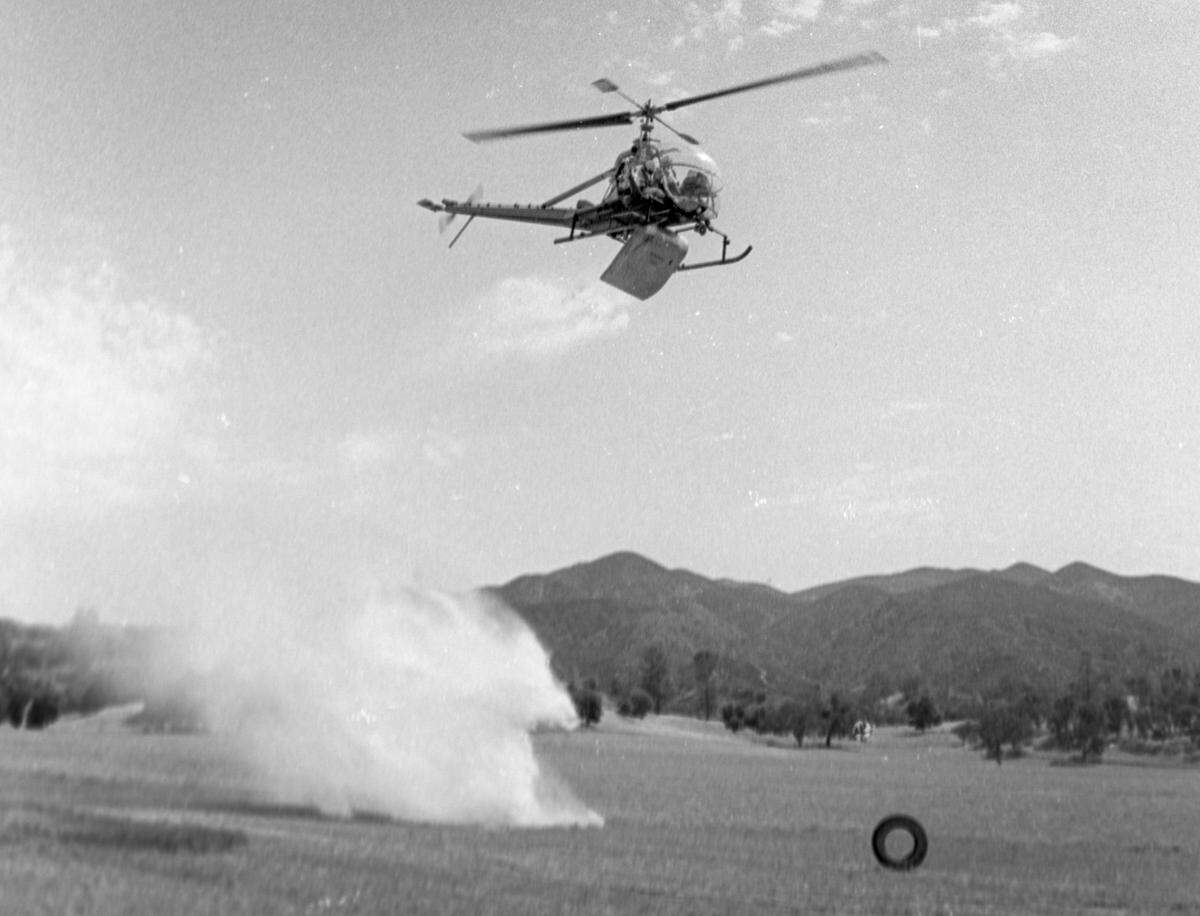 Helicopter practices a water drop. Helitack crew trains near Pozo seen here on July 17, 1967