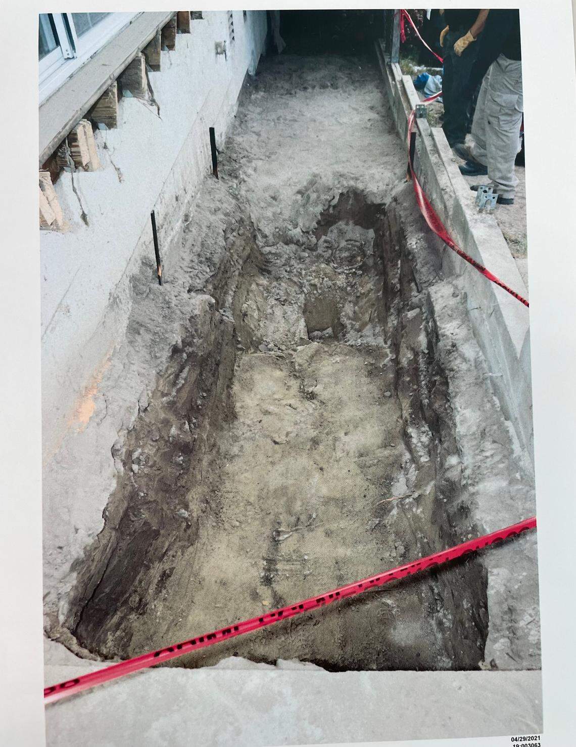 A photo of the soil disturbance found underneath Ruben Flores’ deck is shown to jurors overseeing the Kristin Smart murder trial at Monterey County Superior Court on Sept. 1, 2022. The photo depicts the hole in the middle of the digging process.