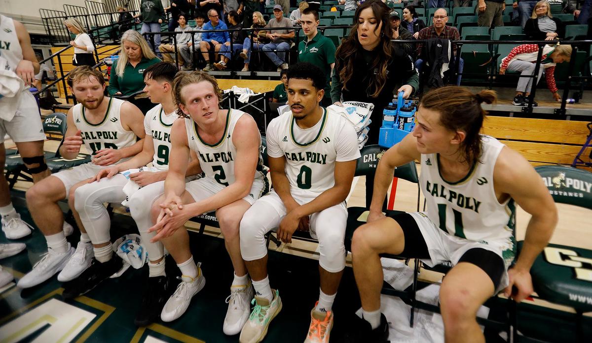 After the game win Cal Poly players, from left, Isaac Jessup, Peter Bandelj, Mac Riniker, Jarred Hyder and Owen Koonce bask in the win. Cal Poly Mustangs beat the Denver Pioneers 95-94 in overtime at Mott Athletic Center at Cal Poly’s San Luis Obispo campus, Tuesday, Dec. 17, 2024.