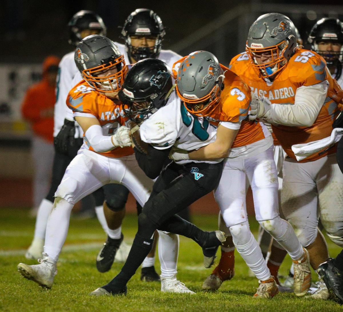 Cole Loney, 85, and Tyler Puentes,3, bring down Anthony Arias. Atascadero High School beat Pioneer Valley 27-13 to win the Division V, 2022 CIF Central Section Football Championships Nov. 25, 2022. Loney will be a key player to watch for Atascadero this season as a tight end and linebacker.