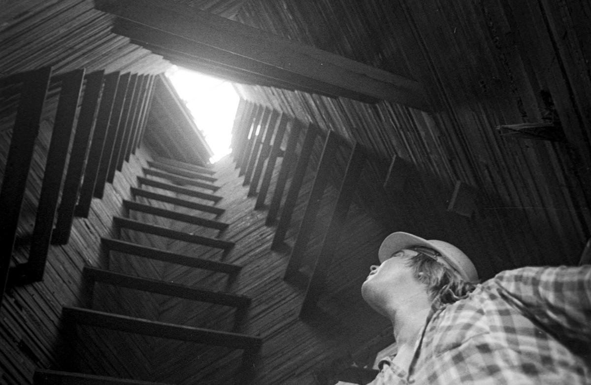 Bobby Jermin gazes up at the burned-out top of the Templeton Feed and Grain mill as work began to restore the fire-damaged landmark on Oct 4, 1979.