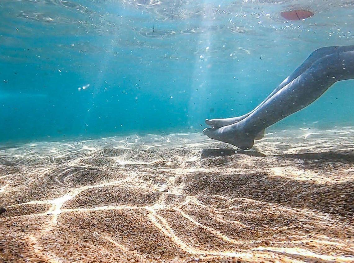 A young swimmer enjoys Lake Tahoe at Pope Beach in July.