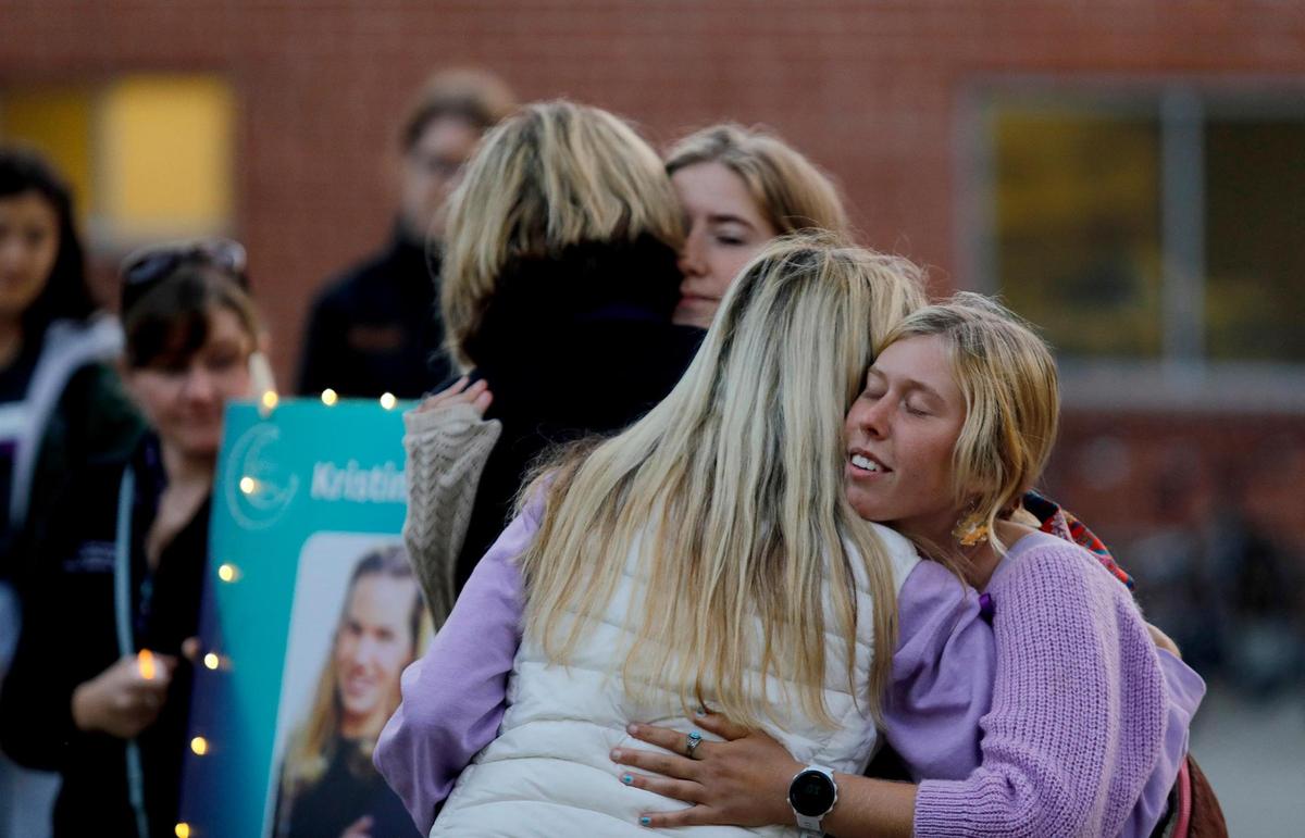 Students organizers Kallie Kidder, right and Layla Burack get a hug from Smart family friends Susan Jolly, right and Therese Cron, left. A vigil organized by Cal Poly Safer, a group that focuses on education and prevention of sexual and gender-based violence. for Kristin Smart was held on the Cal Poly Campus Friday evening, Oct. 21, 2022. (Laura Dickinson, The Tribune San Luis Obispo)