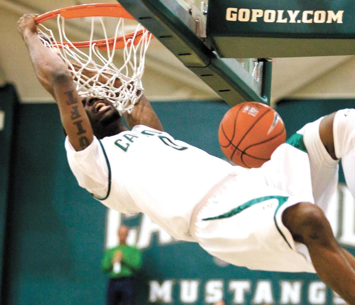 David Nwaba finishes a dunk as Cal Poly hosts Northridge for college men’s basketball at Mott Athletics Center in 2013.
