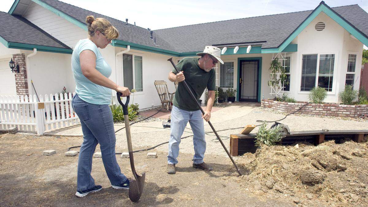 Bret and Julia Harrison are taking out their Paso Robles lawn and installing drought-tolerant landscaping. The city offers financial incentives for residents who make similar changes. 