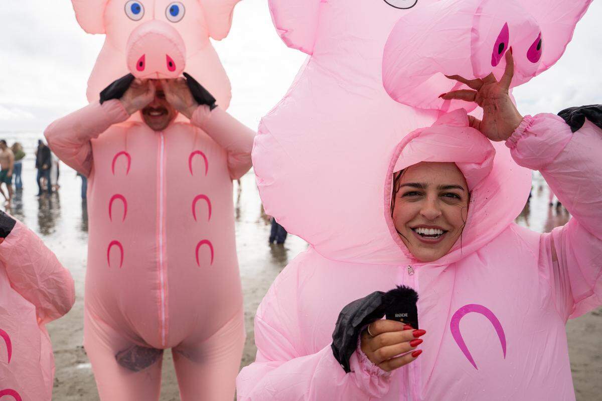 Fresno resident Ellie Delana steps out of the waters of the Pacific following the annual Carlin Soulé Memorial Polar Bear Dip on Thursday, Jan. 1, 2026. The 46th annual dip drew thousands of divers even amid overcast and rainy weather.