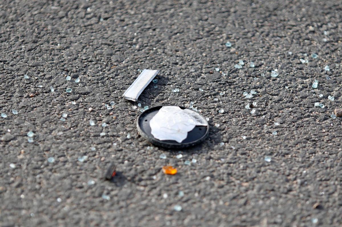 Shards of glass and car parts remain at Spring and 34th streets in Paso Robles, where a 17-year-old died when his speeding car crashed into two other vehicles in the intersection on Thursday, Jan. 13, 2022.