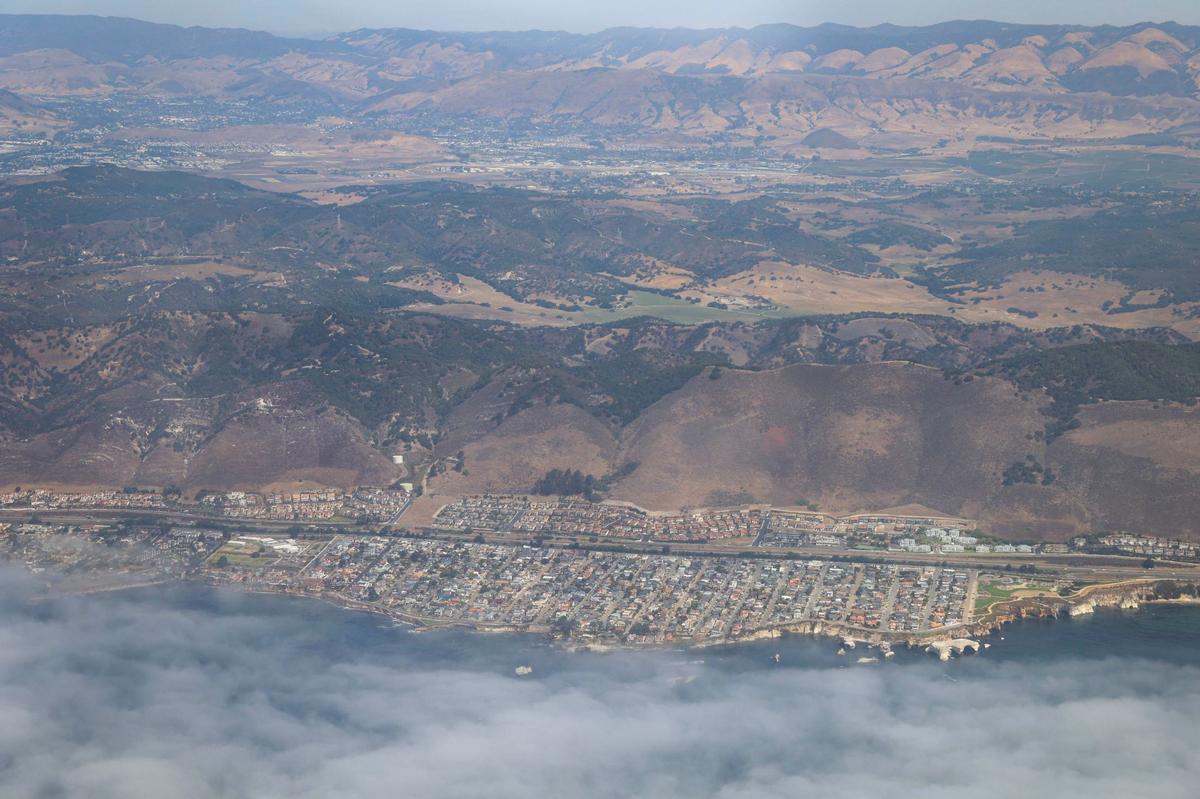 Shell Beach and Highway 101 can be seen in the foreground, while Dinosaur Caves Park is at the lower right and the Santa Lucia Range is in the distance. Pismo Beach is derived from the Chumash word for tar, “pismu.” The Northern Chumash Tribal Council organized an aerial tour of lands bordering the Chumash Heritage National Marine Sanctuary on Sept. 18, 2024. 