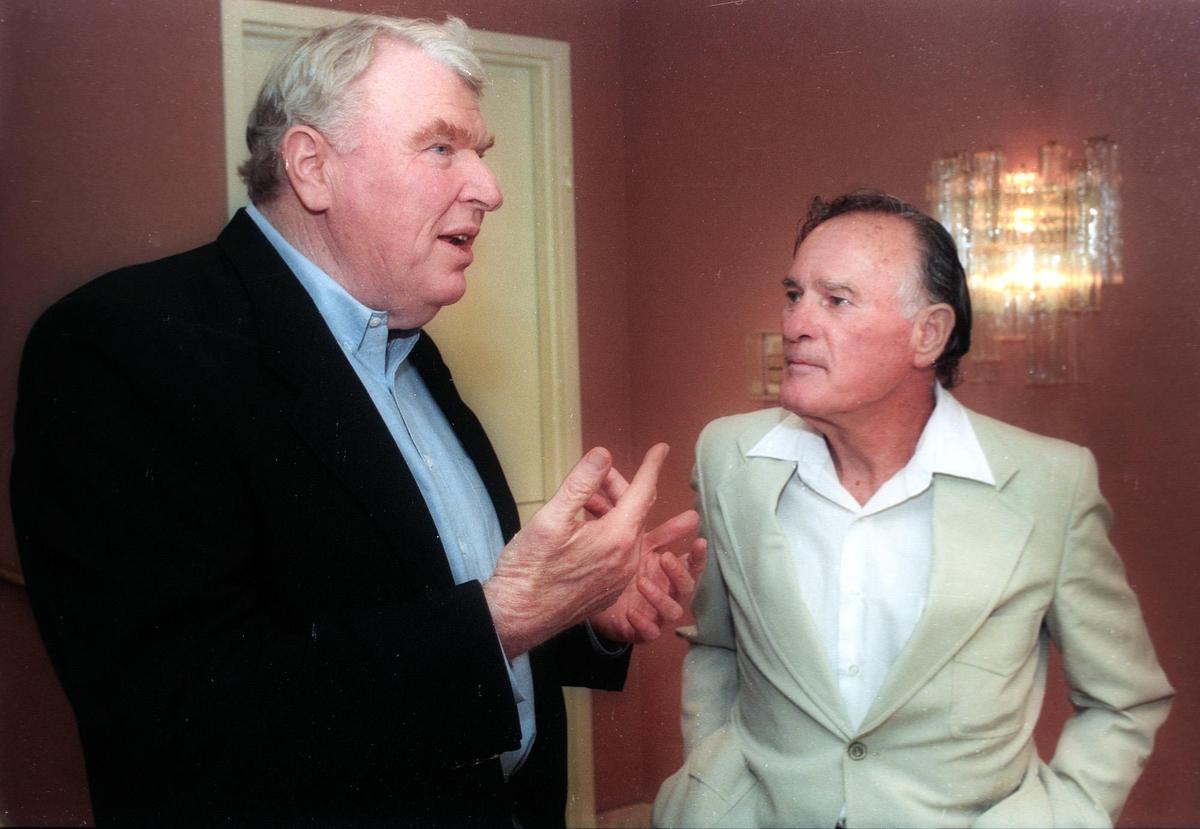 John Madden, left, talks with Cal Poly Athletic Hall of Fame member Tom Lee at a reunion held at The Cliffs in Shell Beach on June 21, 1996.