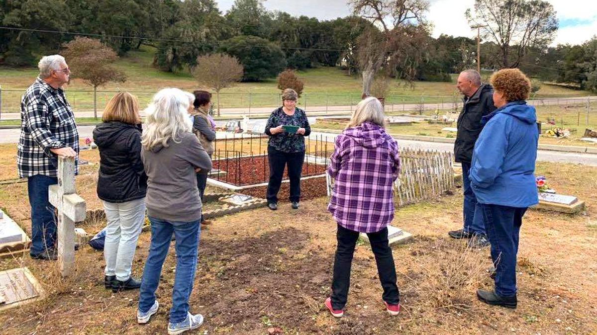 Pam Parsons speaks at a headstone dedication ceremony for murder victim Cheryl Ann Manning. The grave had no permanent marker for more than 40 years.