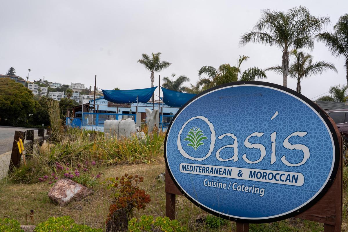 The century-old restaurant building currently occupied by Oasis Moroccan Restaurant along with an old gas station and 10 houses near the intersection of Price and Dolliver streets in Pismo Beach, California, are slated for demolition as part of a new mixed-use “gateway” project from developer Coastal Community Builders, pictured here Wednesday, June 4, 2025.