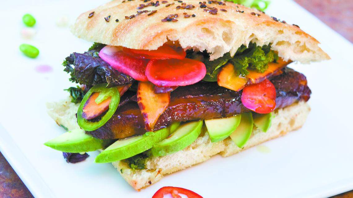 Lunch dishes include appetizers, salads and sandwiches, like this Vietnamese-style pork belly sandwich.