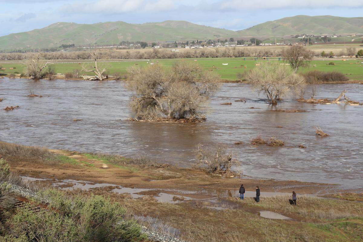 Lynne Yim and Tyler and Melanie Doan search the banks of the Salinas River north of Paso Robles for missing 5-year-old San Miguel kindergartner Kyle Doan on Jan. 10, 2023.