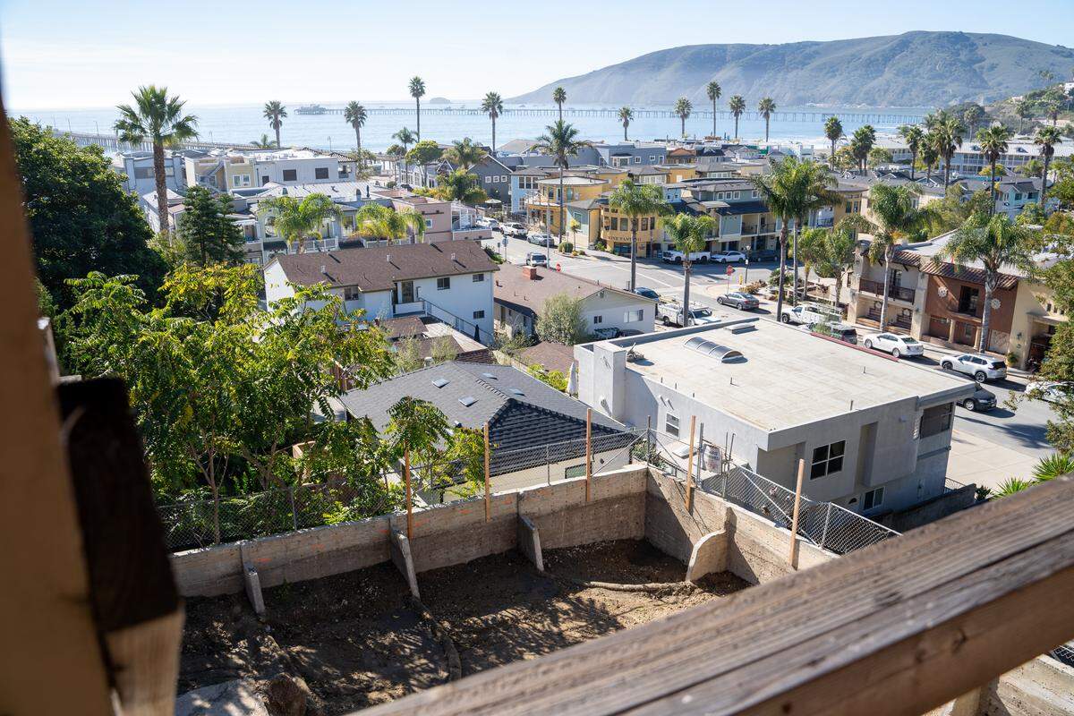 The Dun Sailing property overlooks Avila Beach from behind a retaining wall under construction on Monday, Nov. 24, 2025. The building started a significant renovation in 2018 but was delayed by COVID-19 and permitting issues until 2025.