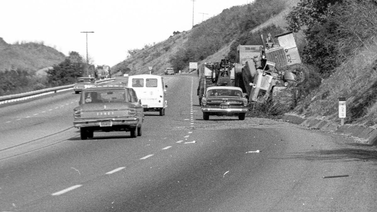 Cuesta Grade accident on Dec. 12, 1963. Heavy equipment truck crosses over and rolls.