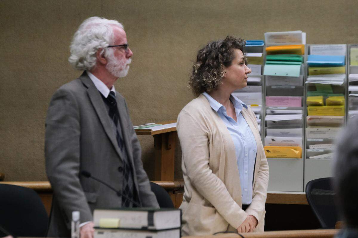 Brandi Turner, right, and her attorney Jeffry Radding listen as the verdicts are read in the murder trial against her on Jan. 24, 2022. A jury could not agree on whether she murdered Quinn Hall when she sold him the fentanyl that killed him, and the judge declared a mistrial.