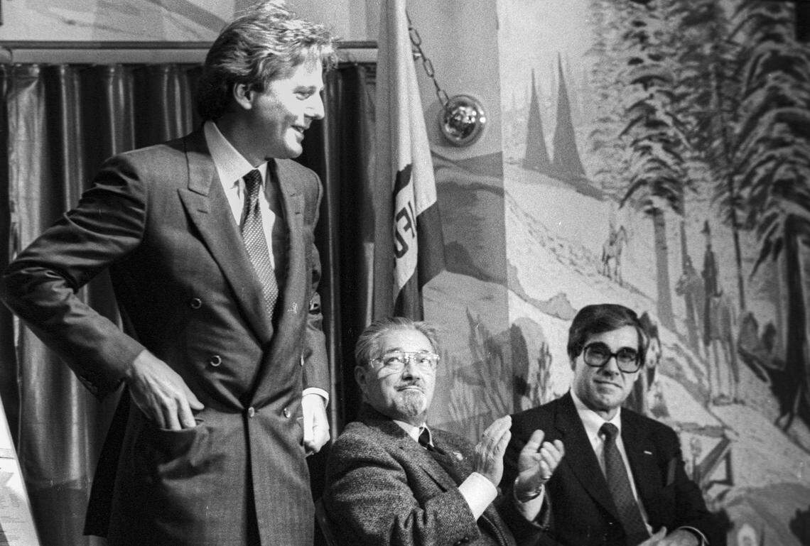 Christopher Cohan, left, receives applause from Mayor Ron Dunin and Cal Poly President Warren Baker at 1990 press conference. Cohan donated $2.1 million to building the PAC, the largest donation to that date to a California State University. Dunin, born in Poland, carried a deep belief in the value of performing arts.