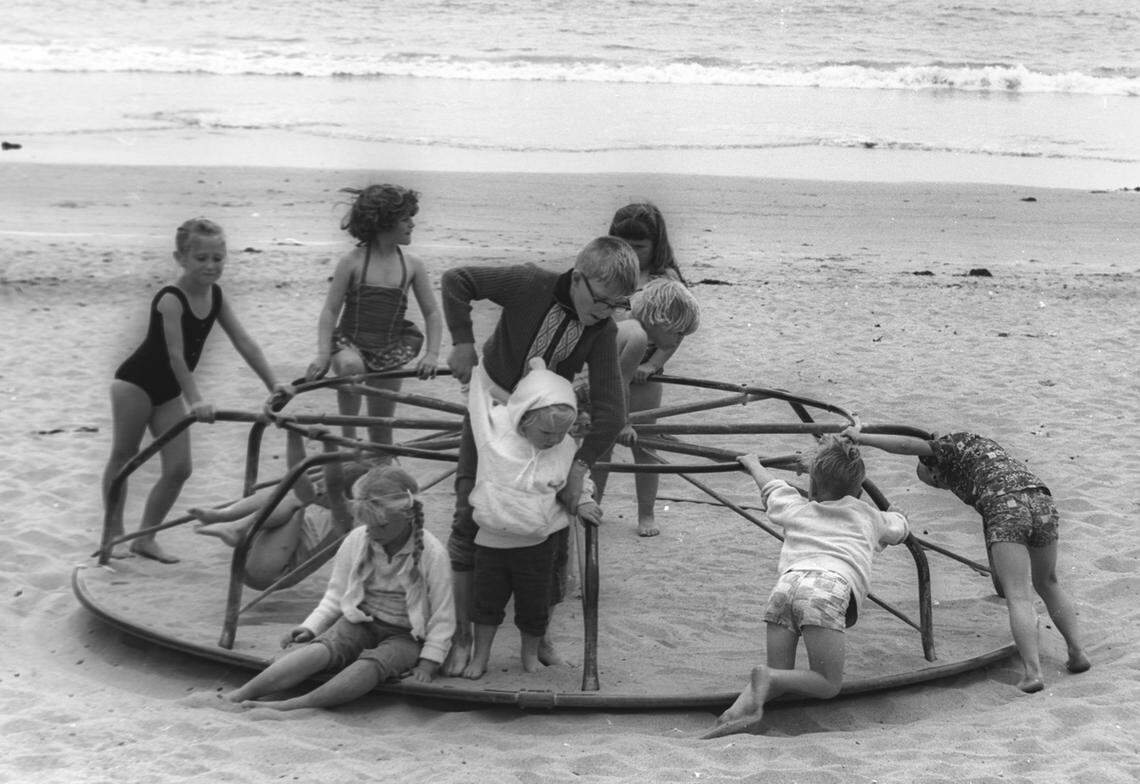 School out Avila Beach June 16, 1964 kids play on merry go round