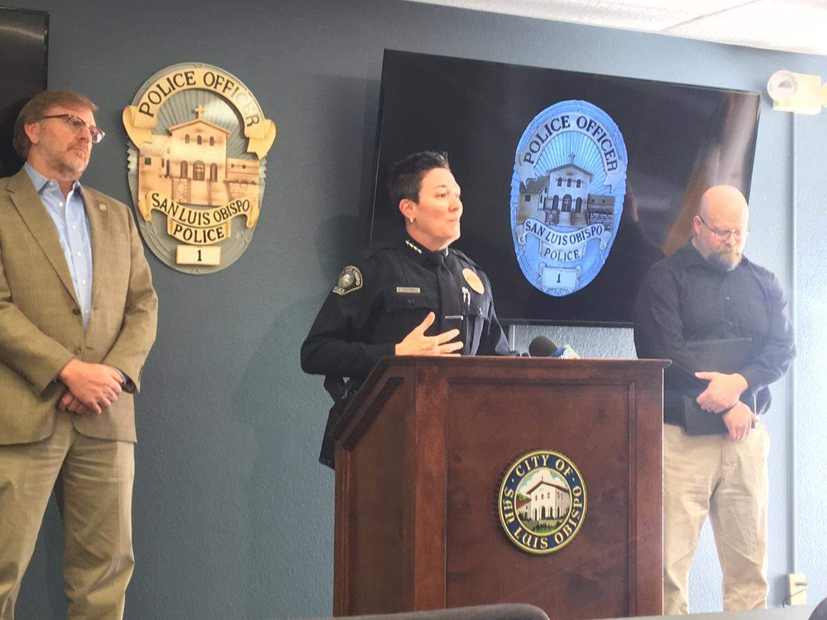 San Luis Obispo Police Chief Deanna Cantrell speaks at a news conference Thursday announcing a plan to pair mental health clinician John Klevins, left, with officers to perform welfare checks and respond to calls for service involving the city’s known chronic low-level offenders or homeless.