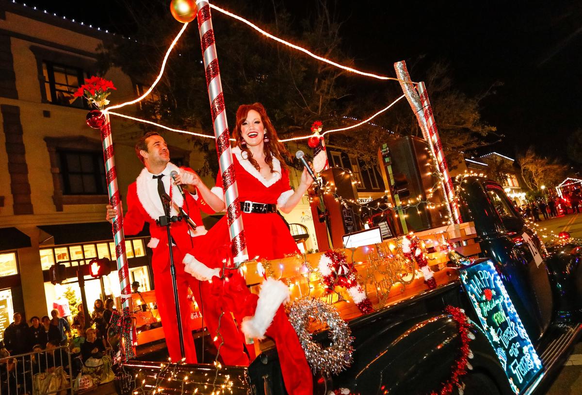 Paul and Beth Wagner of Truck-N-Tunes belt out holiday songs as they travel through downtown San Luis Obispo during the 43rd annual Downtown SLO Holiday Parade in 2018.