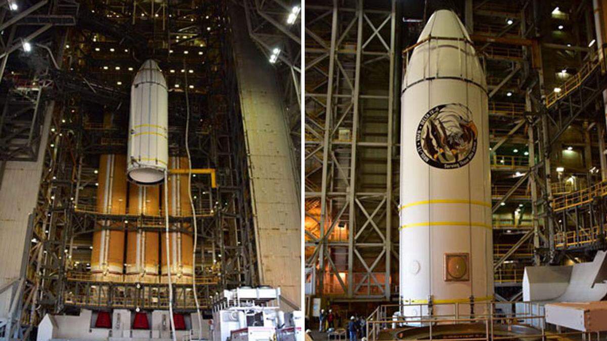 The Delta IV Heavy rocket’s payload fairing is lifted into place at Space Launch Complex-6 at Vandenberg Air Force Base in preparation for the launch of a national security payload. The mission sticker says “Serving those who served.”