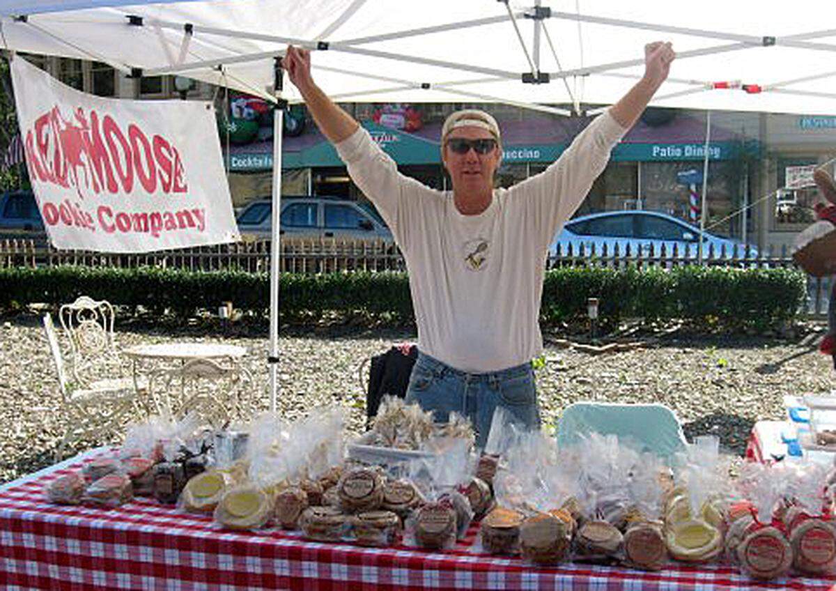 In the early days of Cambria’s Red Moose Cookie Company, co-owner Roger Wall used to set up a small booth at various events from which to sell the shop’s homemade cookies, as was the case here at a celebration at the Cambria Historical Museum. He recently sold the compact bakery to the Nichol family.