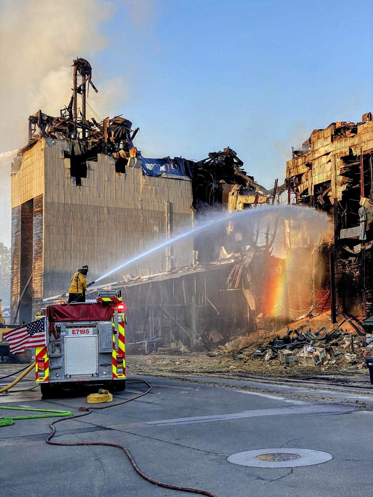 Firefighters spray water on the Templeton Feed & Grain fire in downtown Templeton.
