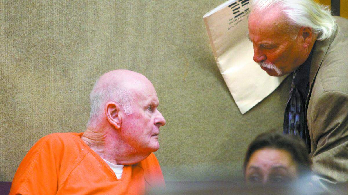 Al Moriarty consults with attorney Ron Crawford during a hearing on May 5, 2013.