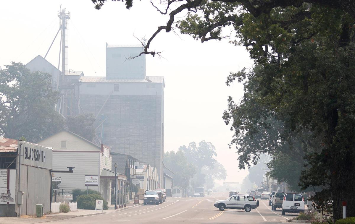 Smoke shrouds the Grainary building and Main Street in downtown Templeton.