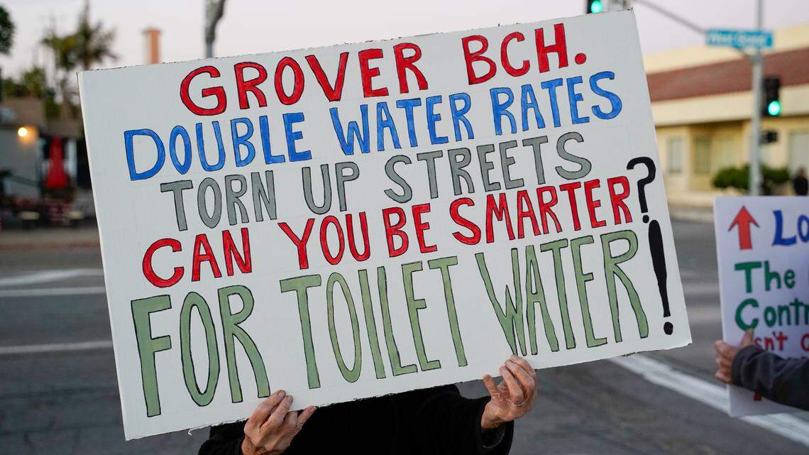 Grover Beach residents protest a proposed 91.7% water rate increase over the next five years, before the Grover Beach City Council meeting on Nov. 13, 2023. Some residents said they have started knocking on doors, encouraging their neighbors to write letters of protest against the project.