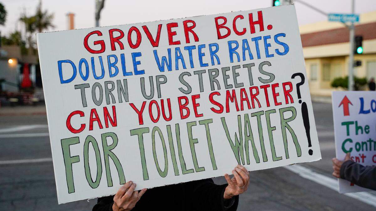 Grover Beach residents protest a proposed 91.8% water rate increase over the next five years, before the Grover Beach City Council meeting on Nov. 13, 2023.