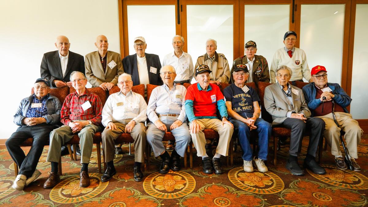 Fifteen of the 16 World War II veterans at Tuesday’s lunch pose for a group photo at the San Luis Obispo Country Club.