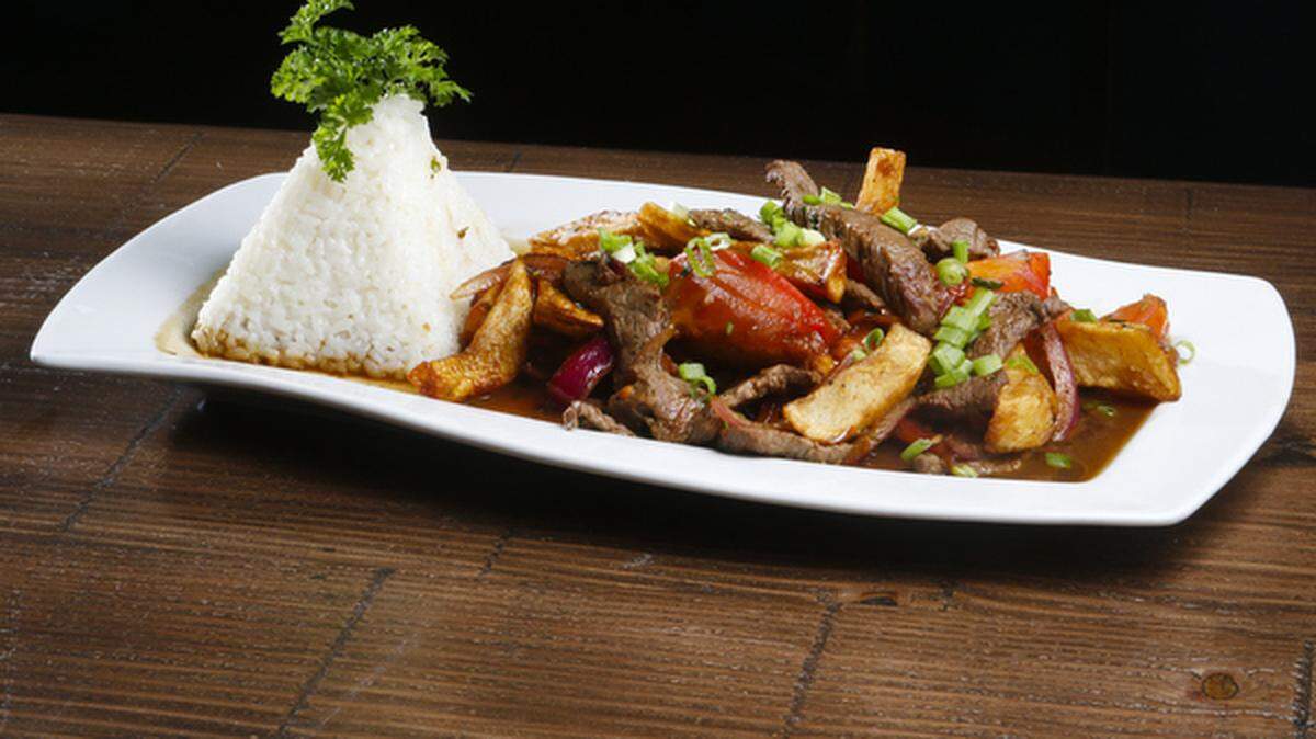 Un Senor Lomo at Mistura in Paso Robles features free-range, natural top sirloin strips stir-fried with organic tomatoes, red onions, Peruvian spices, aji amarillo, soy sauce, potatoes and parsley served with Peruvian white rice.