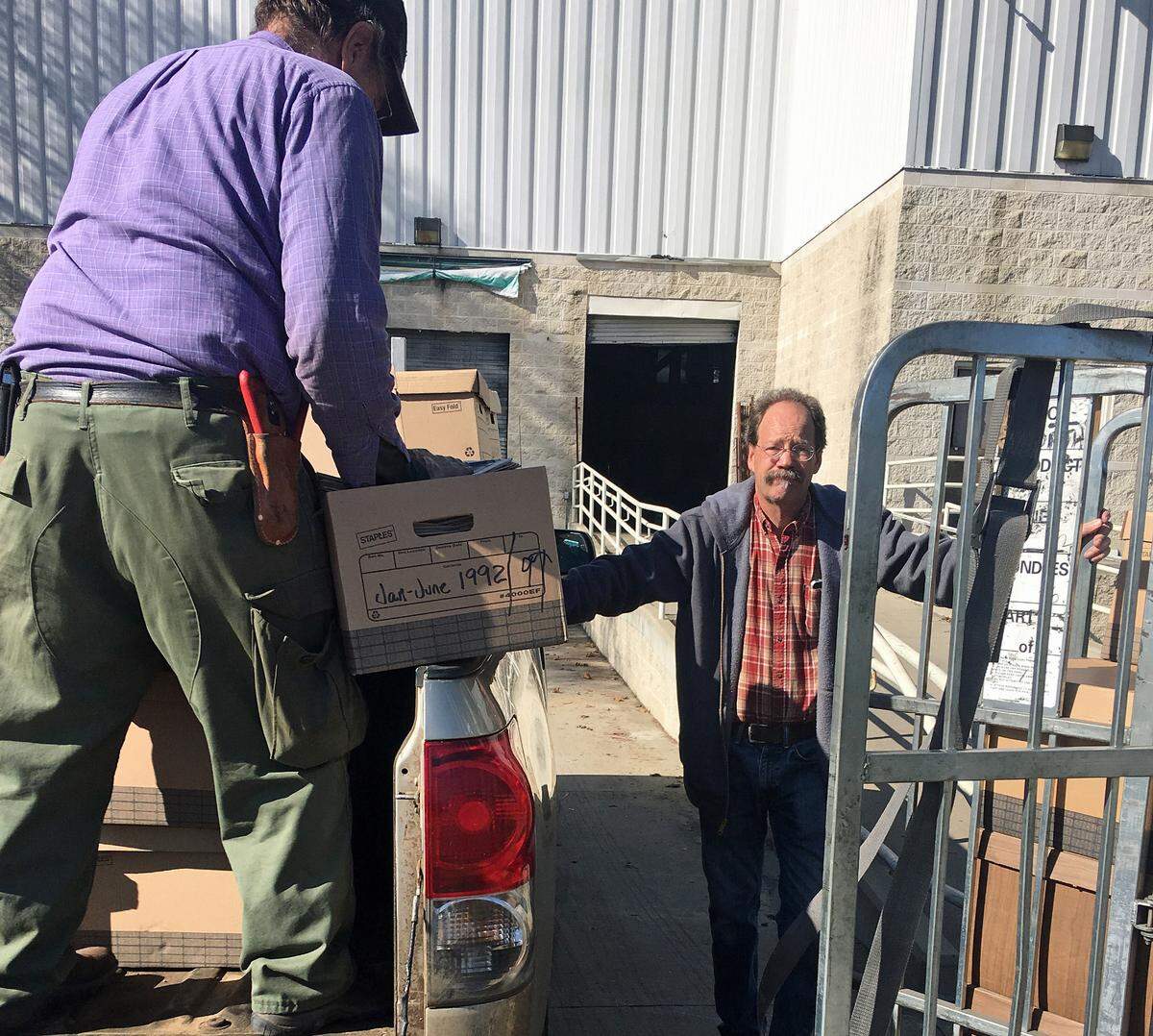 It was a race to the finish to move all the past issues of Cambria newspapers into safekeeping in Cambria Historical Society archives, where they’re currently being digitized. At left, Mike Rice, Cambria landscaper and history buff, and Tribune photographer/historian David Middlecamp shift thousands of newspapers for the transfer to Cambria from the Trib’s former office in San Luis Obispo.