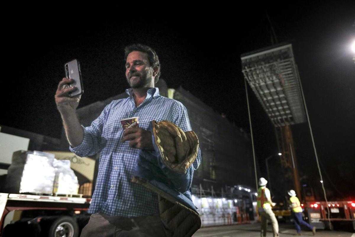 Developer Hamish Marshall of Garden Street SLO Partners LP takes a selfie as the first half of the Hotel Serra pool is lifted from the Marsh Street to the roof in July.. At about 10 p.m., workers blocked off the street between Garden and Broad as they hoisted two halves of a custom-made stainless steel pool. It will be the first rooftop pool in San Luis Obispo. ”The pool is 15 feet by 40 feet, and it’s quite something,” said Hotel Serra managing partner Shaun Matthews before the lift. “It will weigh about 215,000 pounds when it’s full of water ... and will be a wonderful amenity for the hotel downtown.”