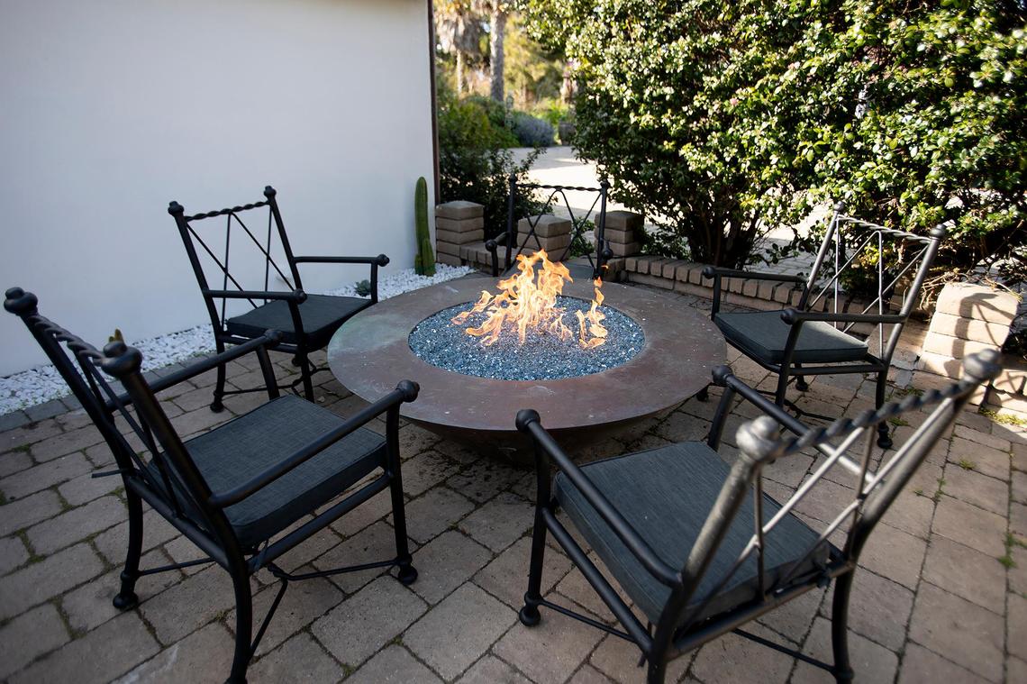 Warm fire pits grace the waiting area patios where patrons can site in front of a fire at Mirazur Restaurant in Los Osos.