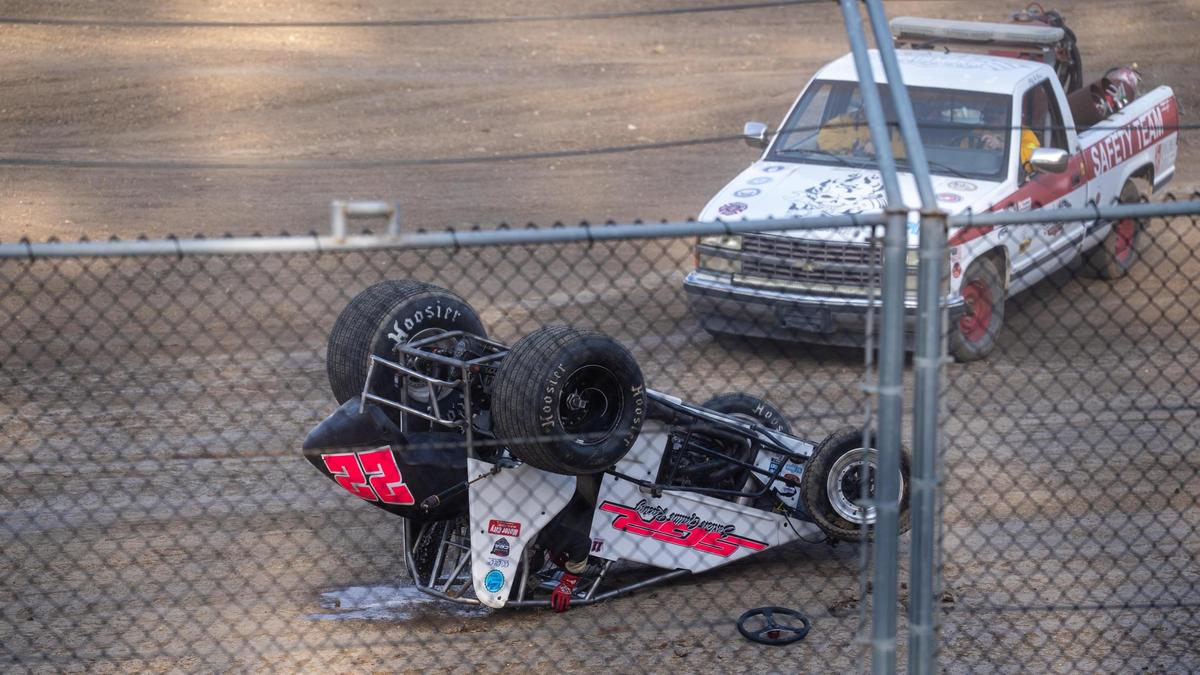 A safety team tends to a “midget” car and its driver that rolled over during warm-ups at the Santa Maria Speedway, pictured Saturday, May 17, 2025.